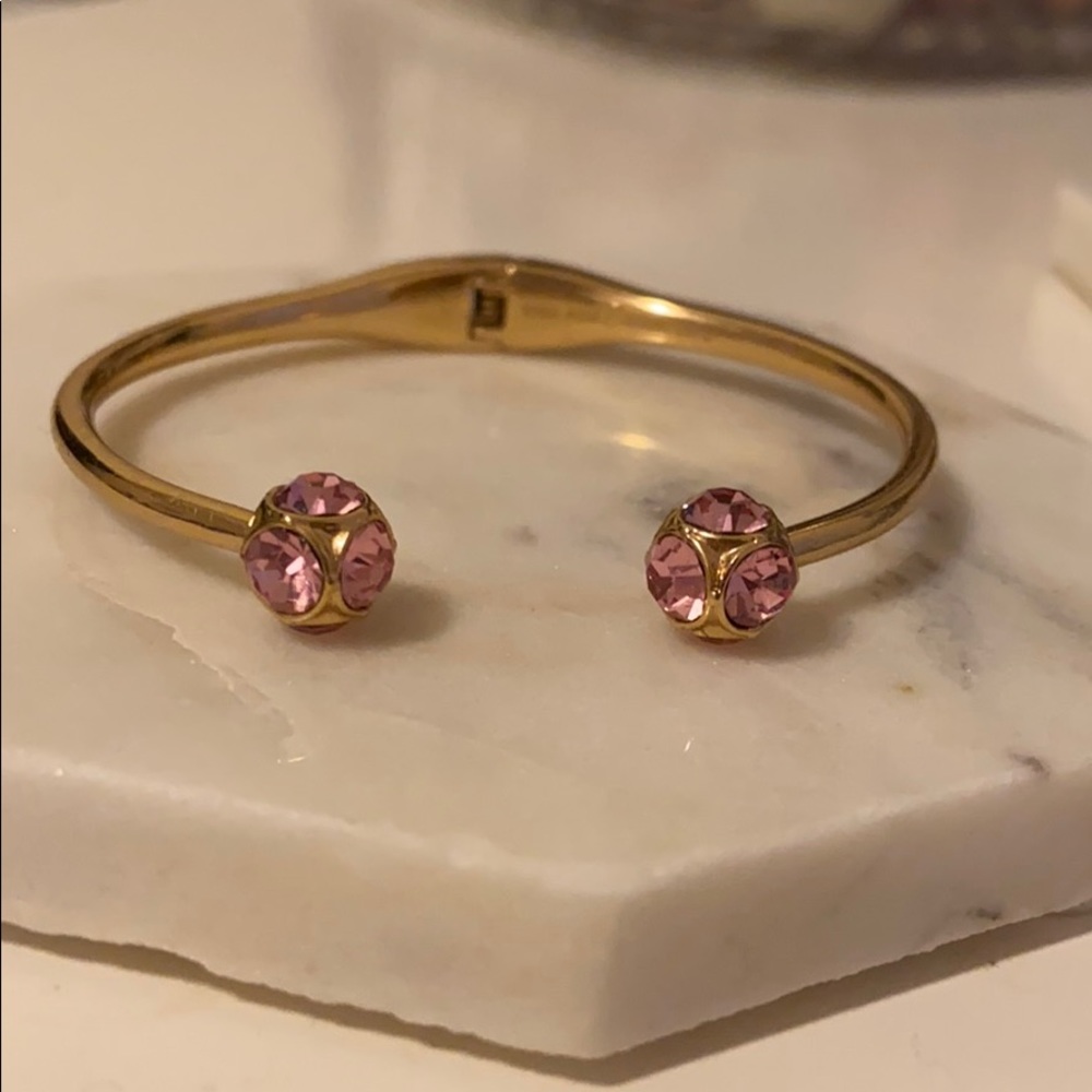 Kate Spade gold bracelet with pink jewel accents